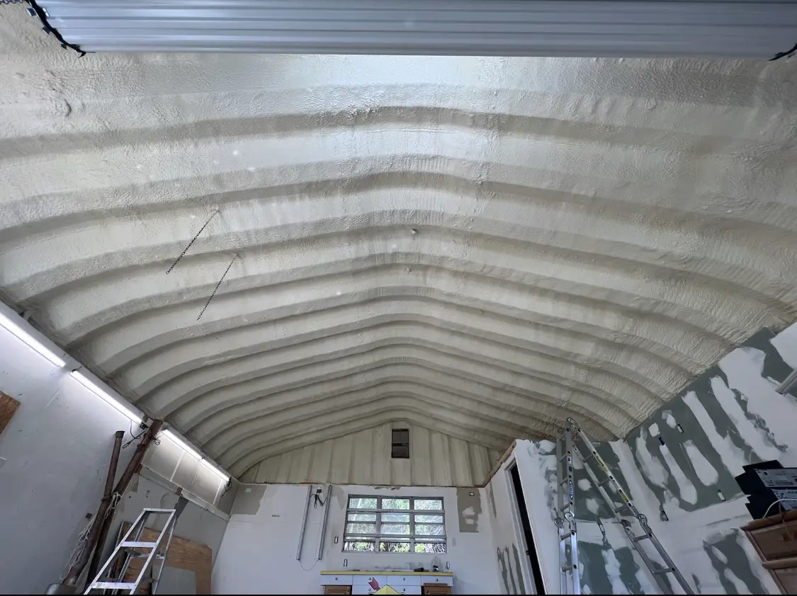 Spray polyurethane foam applied to the underside of a metal roof deck in Terrytown